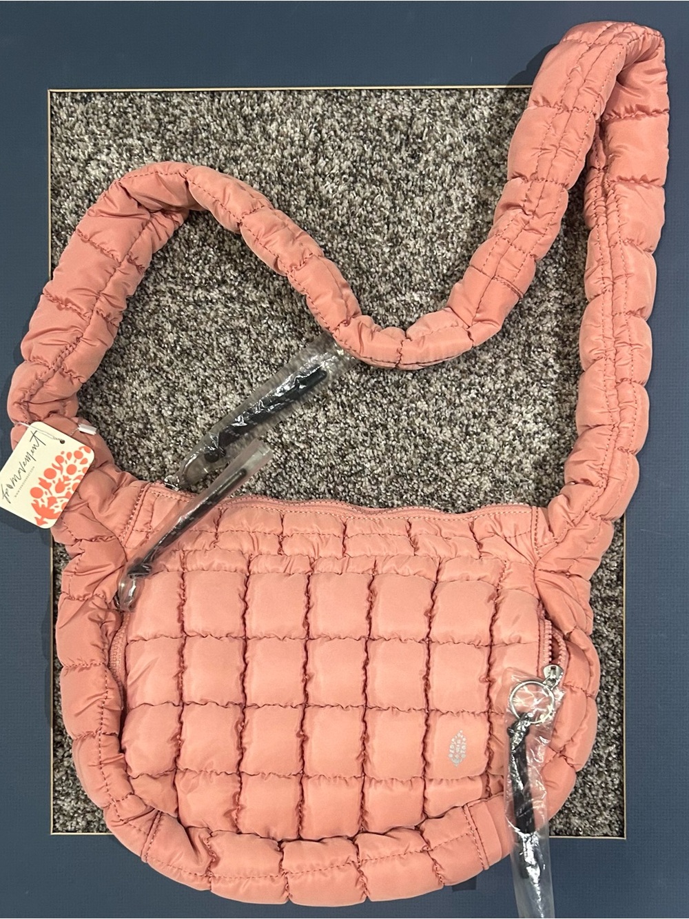 FP Movement by Free People Quilted Puffer Crossbody Bag in Dusty Pink - Picture 1 of 3